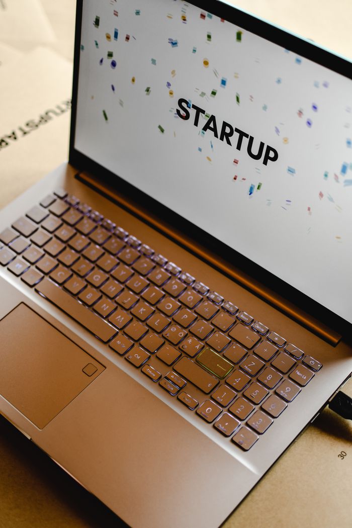 services-02 Close-up of a laptop screen displaying the word STARTUP, ideal for business and tech themes.